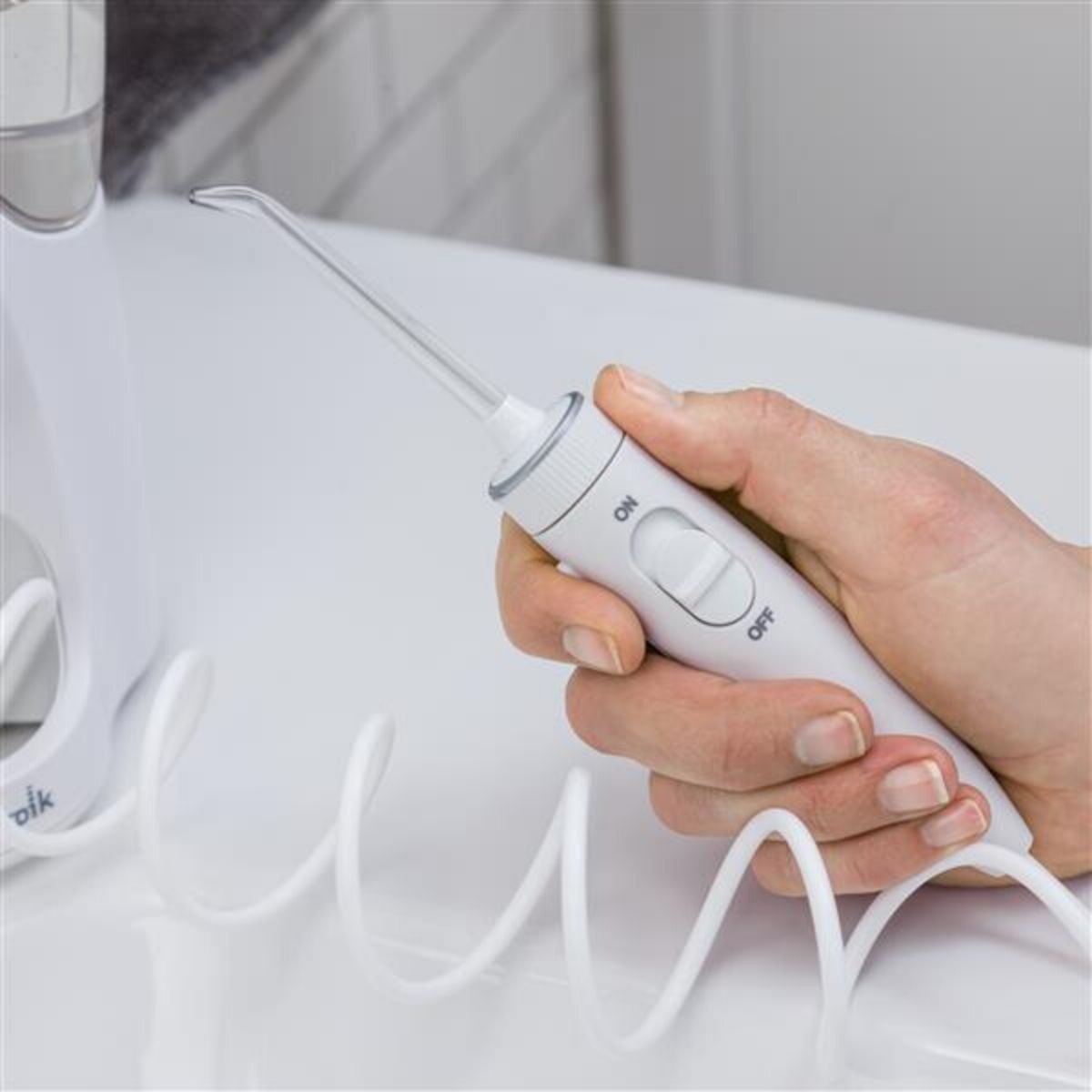 Irygator Waterpik WP-160 uchwyt z przyciskiem on/off